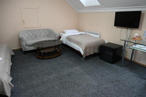 TV a/nebo společenská místnost v ubytování NoirHotel