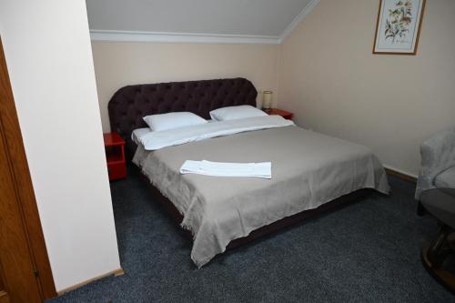 Postel nebo postele na pokoji v ubytování NoirHotel