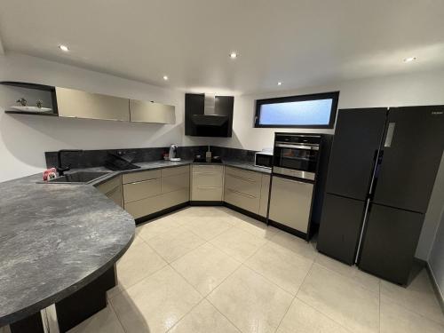 Kuchyň nebo kuchyňský kout v ubytování A l'ancienne boulangerie