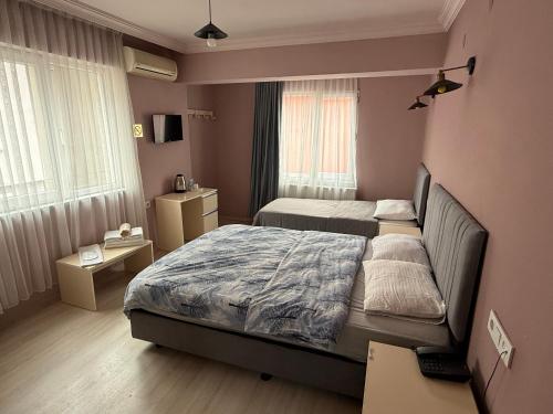 Ένα ή περισσότερα κρεβάτια σε δωμάτιο στο Flora Otel 16 rooms