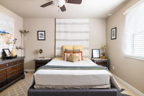 a bedroom with a bed and a ceiling fan at Ventura Blvd Guest House in Litton Industries Heliport