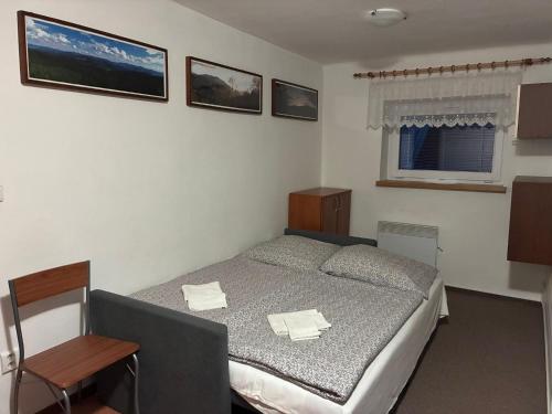 Postel nebo postele na pokoji v ubytování Apartmány Růže