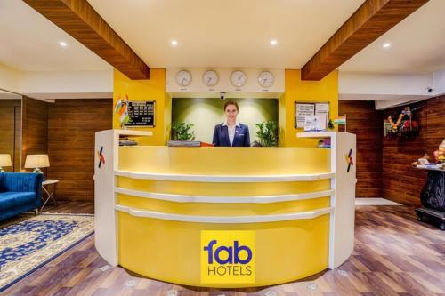 a reception area of a hotel with a frito hotel sign at FabHotel Devanshi Inn in Kalamboli