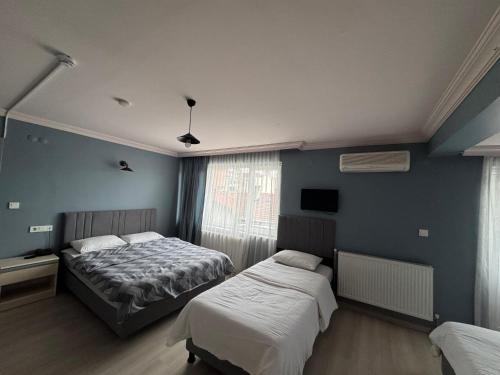 Ένα ή περισσότερα κρεβάτια σε δωμάτιο στο Flora Otel 16 rooms