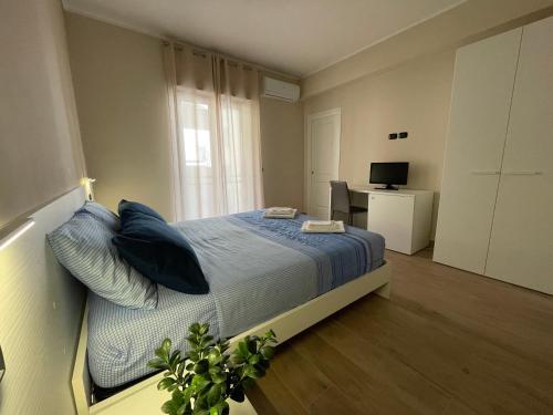 Postel nebo postele na pokoji v ubytování Casa Viale Kennedy