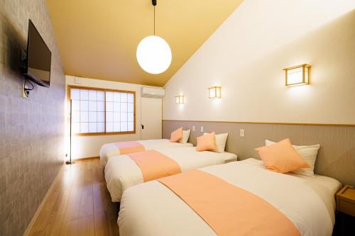 Ένα ή περισσότερα κρεβάτια σε δωμάτιο στο Fuga Bettei Shijyo Omiya