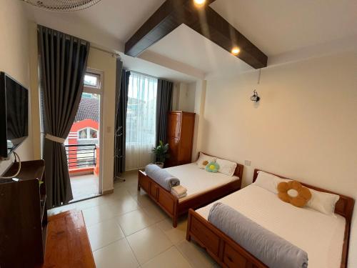 Ένα ή περισσότερα κρεβάτια σε δωμάτιο στο Kim Quang