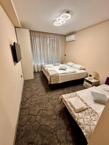 Кровать или кровати в номере Hotel Ponti