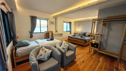 Ένα ή περισσότερα κρεβάτια σε δωμάτιο στο Velora Bay Koh Jum