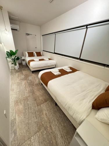 Postel nebo postele na pokoji v ubytování Make Your Hotel ShinjukuYotsuya