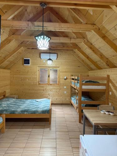 Postel nebo postele na pokoji v ubytování Apartmani Kod Draskovica