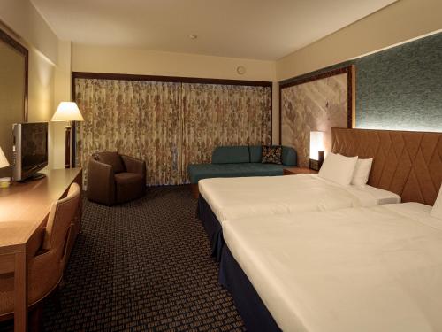 Postel nebo postele na pokoji v ubytování Okinawa Kariyushi Beach Resort Ocean Spa