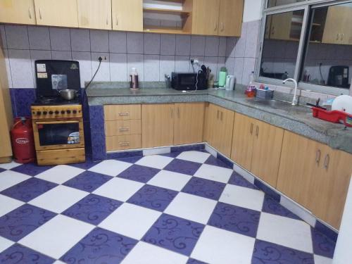 Η κουζίνα ή μικρή κουζίνα στο Fully Furnished rooms in an apartment near down town TF1