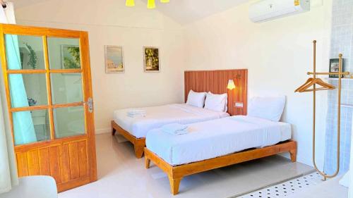 Ένα ή περισσότερα κρεβάτια σε δωμάτιο στο sleep private khaoya unit03