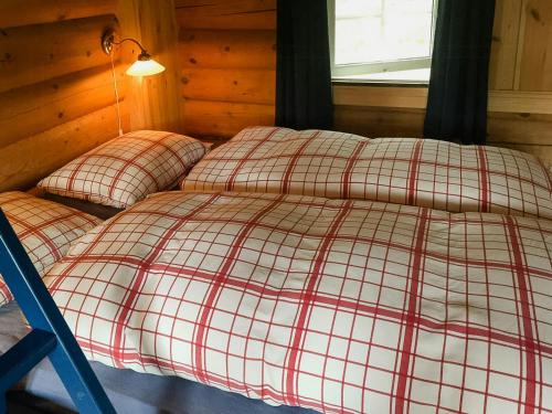 Postel nebo postele na pokoji v ubytování Modern Log Cabin By Hardangervidda