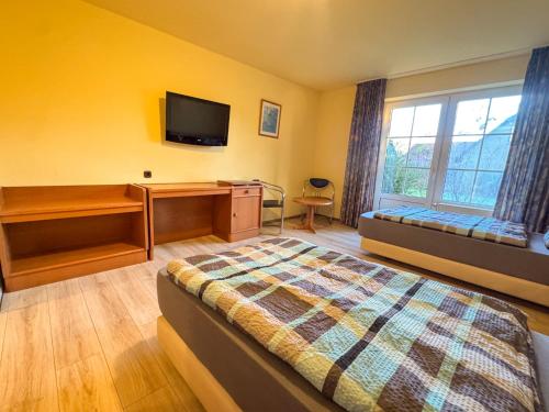 Postel nebo postele na pokoji v ubytování 33 - 4 Hotelkamer voor 2 gasten op de begane grond