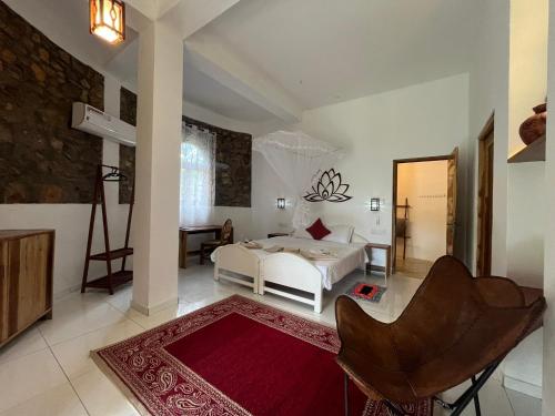 Ένα ή περισσότερα κρεβάτια σε δωμάτιο στο Dune Towers