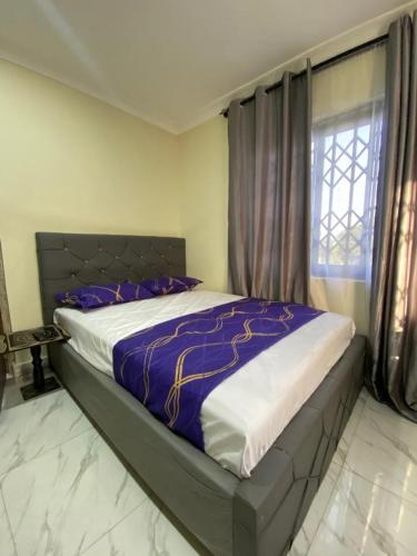 Postel nebo postele na pokoji v ubytování Nick Jaaks Courtyard ACCRA