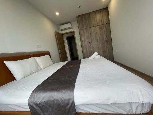 Ένα ή περισσότερα κρεβάτια σε δωμάτιο στο H-Vista Suites - The Wisteria