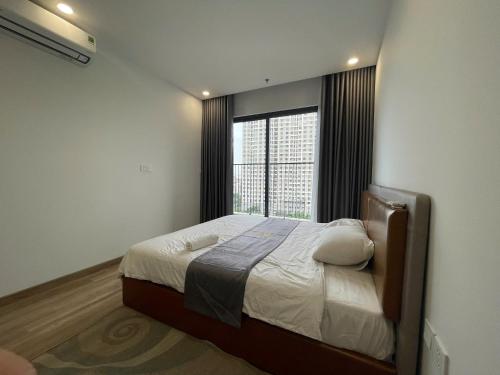 Ένα ή περισσότερα κρεβάτια σε δωμάτιο στο H-Vista Suites - The Wisteria