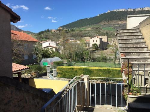a view from the balcony of a house with stairs at Gite du Pallie in Rivière-sur-Tarn