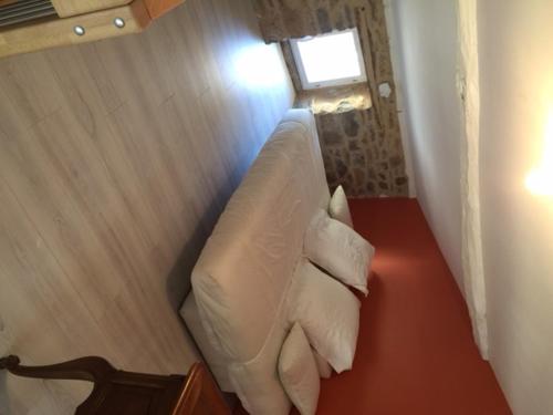 a room with a bed and a window at Gite du Pallie in Rivière-sur-Tarn