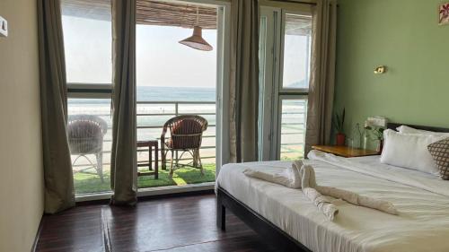 Ένα ή περισσότερα κρεβάτια σε δωμάτιο στο Sea Walk Beach Resort, Palolem, Canacona, Goa