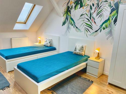 Ένα ή περισσότερα κρεβάτια σε δωμάτιο στο Magenta Apartman