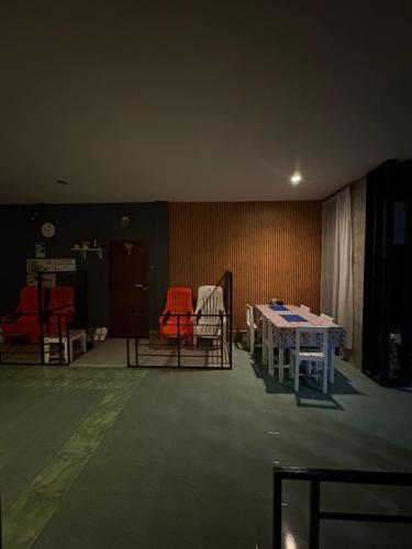 a room with two tables and chairs in it at Krabi Nemo House in Ao Nang Beach