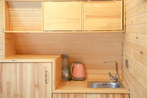 a kitchen with a sink in a tiny house at HK Resort 