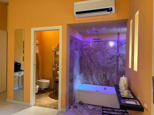 a bathroom with a walk in shower in a room at Locanda La Cavallina in Brisighella