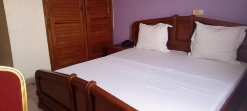 Postel nebo postele na pokoji v ubytování Sand Hall Hôtel