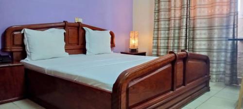 Postel nebo postele na pokoji v ubytování Sand Hall Hôtel