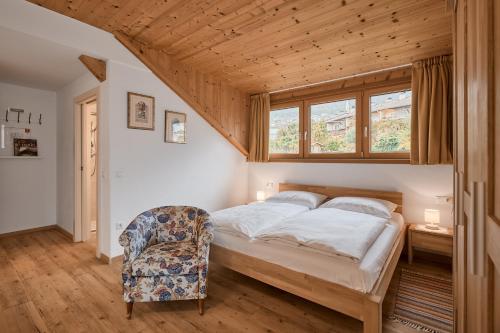 Postel nebo postele na pokoji v ubytování Residence La Terrazza - Südtirol erleben in Kaltern am See