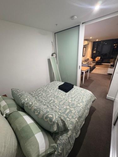 a bedroom with a bed with a pillow on it at Melbourne Yarra View, close to Crown Casino - Moomba Fireworks in Melbourne