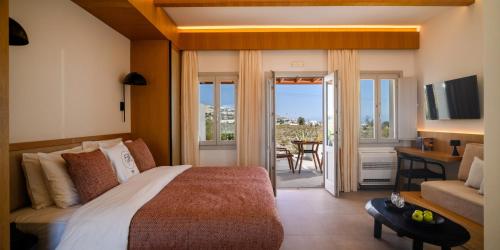 Ένα ή περισσότερα κρεβάτια σε δωμάτιο στο Safrani Suites