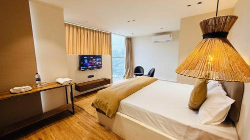 Ένα ή περισσότερα κρεβάτια σε δωμάτιο στο Hotel COCODAN