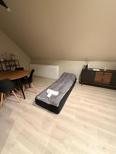 a room with a dog bed on the floor at Central apartment in Svolvær in Svolvær