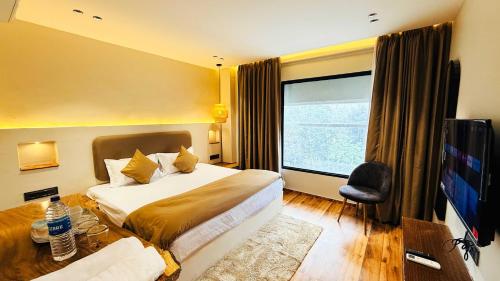 Ένα ή περισσότερα κρεβάτια σε δωμάτιο στο Hotel COCODAN