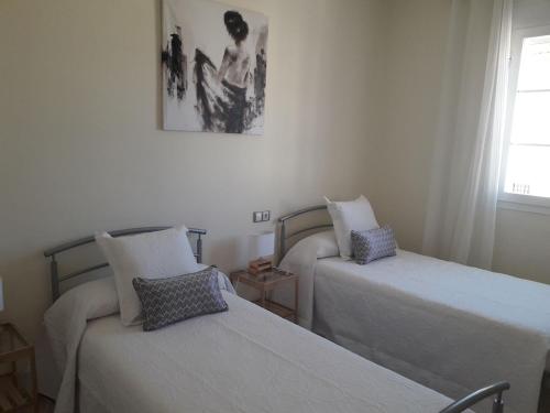 En eller flere senge i et værelse på Casa María Ronda con parking