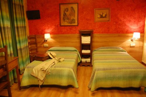 Katil atau katil-katil dalam bilik di Hotel Rural Bidean