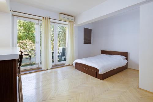 En eller flere senge i et værelse på By the Park