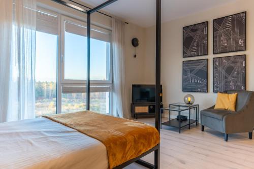 Ένα ή περισσότερα κρεβάτια σε δωμάτιο στο UKIEL PARK 13 przy Plaży Miejskiej Jezioro Ukiel Las