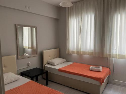 Ένα ή περισσότερα κρεβάτια σε δωμάτιο στο Deka Evleri