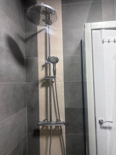 a shower in a bathroom with a glass door at Luxe Loma 2 in Mogán