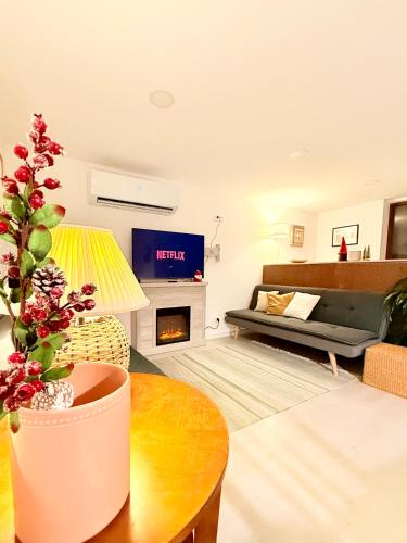 a living room with a couch and a fireplace at Monte do Garnacho - Villa in the Mountains in Sertã
