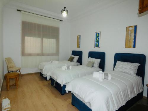 Ένα ή περισσότερα κρεβάτια σε δωμάτιο στο Appartement meuble rabat