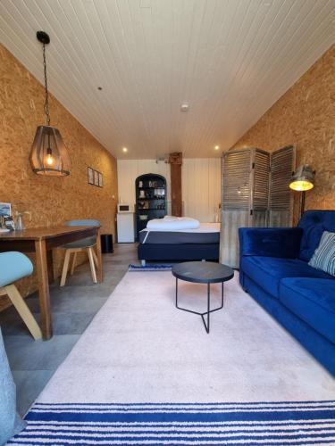 Postel nebo postele na pokoji v ubytování Trekkershut De Tulpenweide