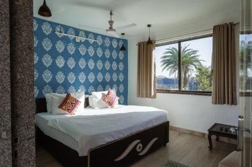 Postel nebo postele na pokoji v ubytování Rudra villas