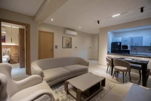 a living room with a couch and a table at The D9 Luxury Suites - Hurghada in Hurghada